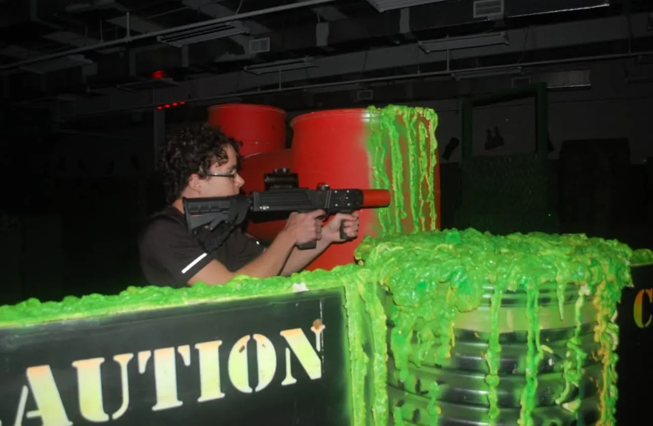 Tactical laser tagger aimed over bright green Toxic Wasteland cover